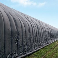 Greenhouse covered with woven polypropylene fabric