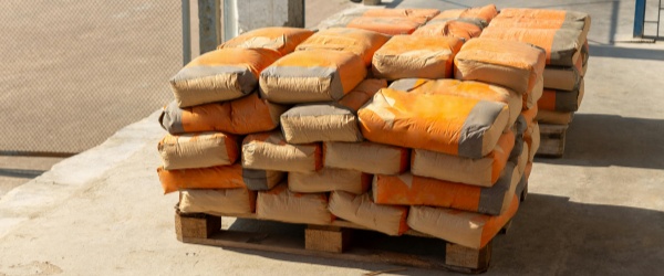 Heavy-duty cement bags stacked on construction site