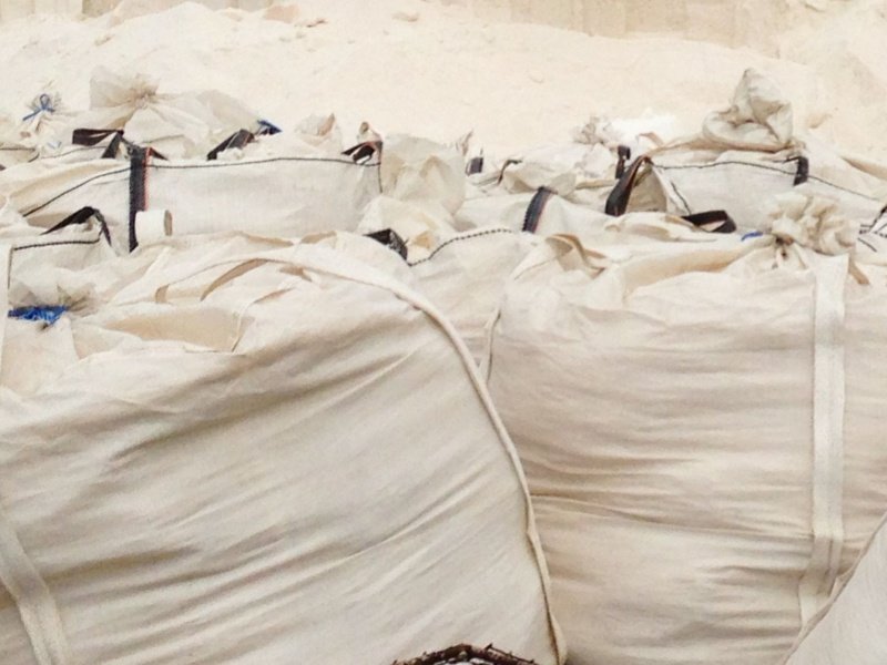Woven FIBC bags and fabric for mining operations